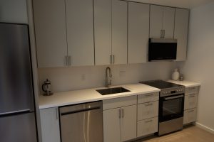 kitchen in housing unit along one wall