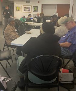 HCA tenants sitting around a table, talking